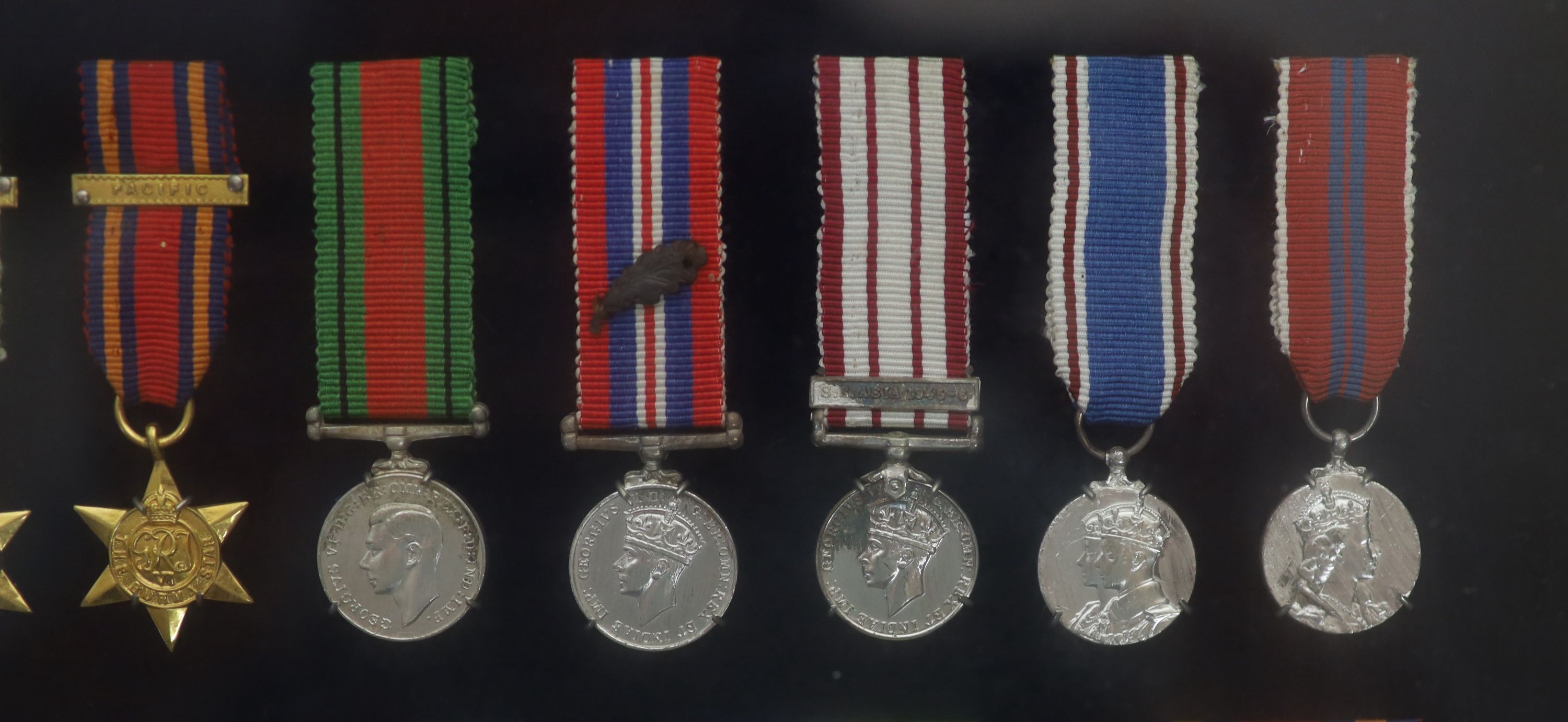 A cased WWI, WWII and Military C.B. medal group to Rear-Admiral John Dent R.N. (1899-1973) and a cased KCVO and Order of St. John to his son Sir Robin John Dent (1929-1999) Case 45.5 x 36 cm